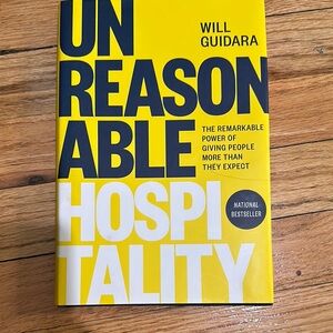 Unreasonable Hospitality Book by Will Guidara - Yellow and Black Cover